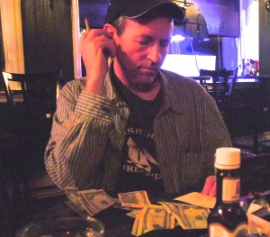 John Gallagher sorting out the dinner bill, last summer in the Catskills, with Matt Cranitch, me, Christy McNamara, Jane Kelton