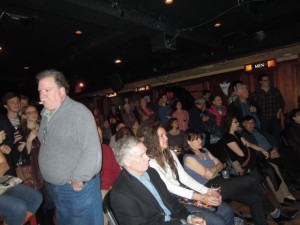 a happy crowd at Connolly's, Paul Keating standing