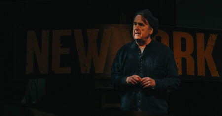 Photo of John McDonagh on stage