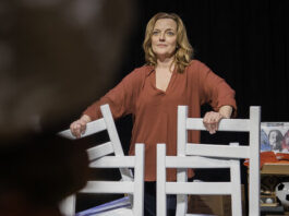 Orlagh Cassidy holds onto the chairs in her set