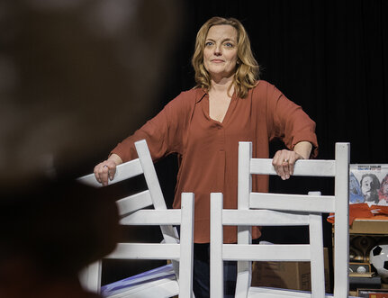 Orlagh Cassidy holds onto the chairs in her set